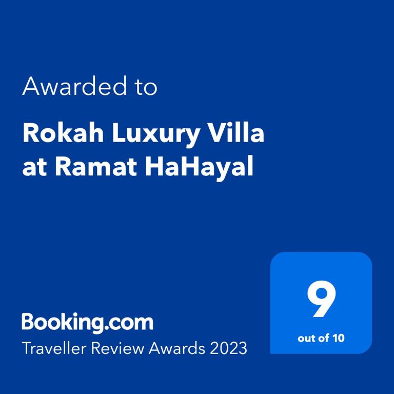 a screenshot of a cell phone with the text awarded to rohan luxury villa at Rokah Luxury Villa at Ramat HaHayal in Tel Aviv