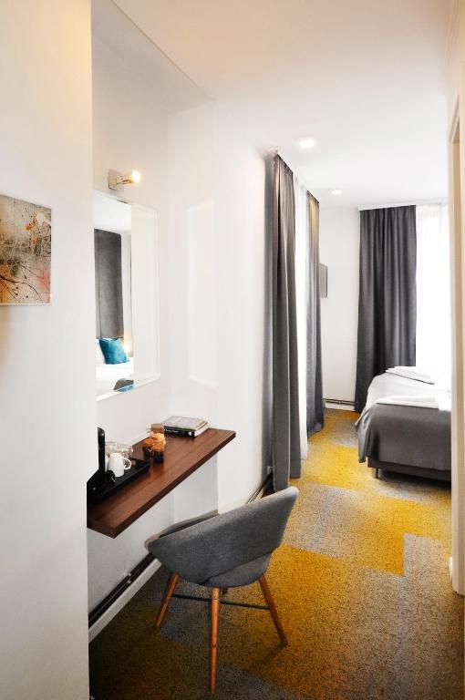 Postel nebo postele na pokoji v ubytování Heritage Hotel Petrakija