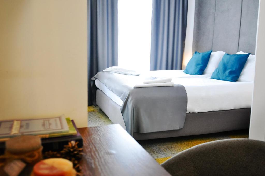Postel nebo postele na pokoji v ubytování Heritage Hotel Petrakija