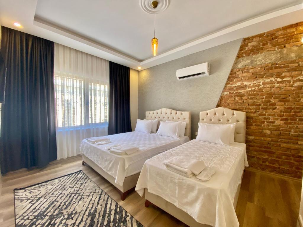 Postel nebo postele na pokoji v ubytování Kesik Apart