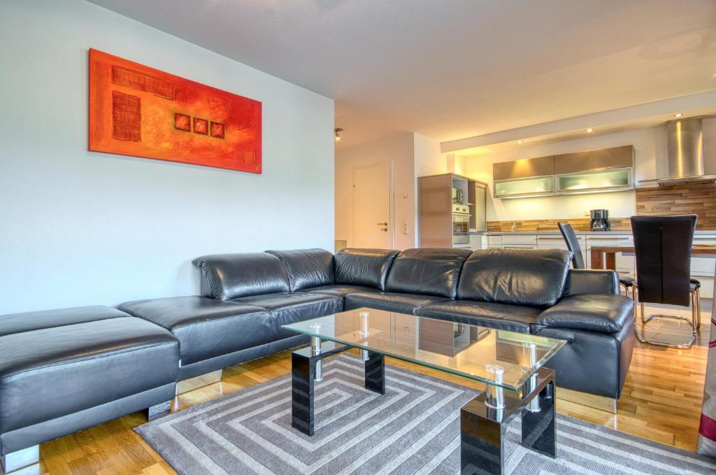 A seating area at Apartment Leon - by Alpen Apartments