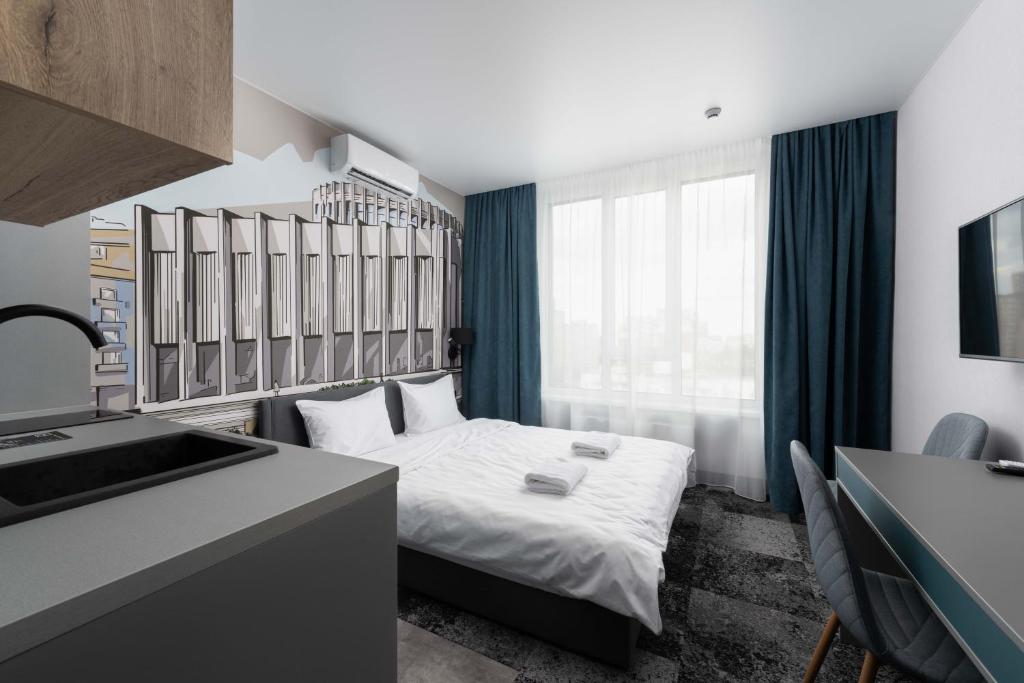 Postel nebo postele na pokoji v ubytování Be The One Hotel