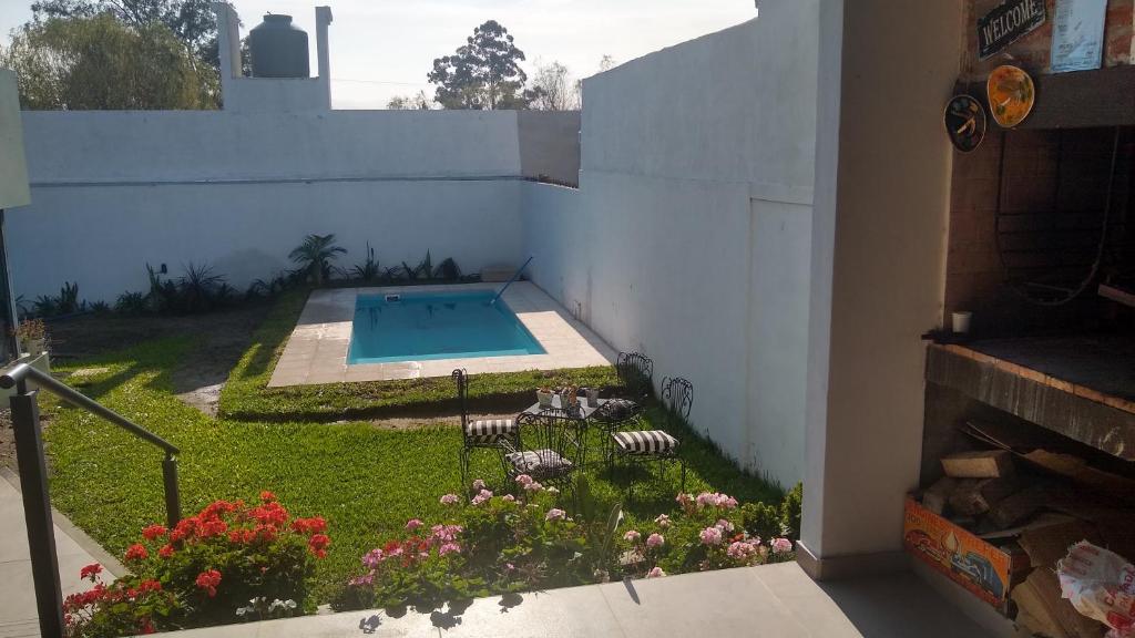 a view of a backyard with a swimming pool at Home J y M in Concordia