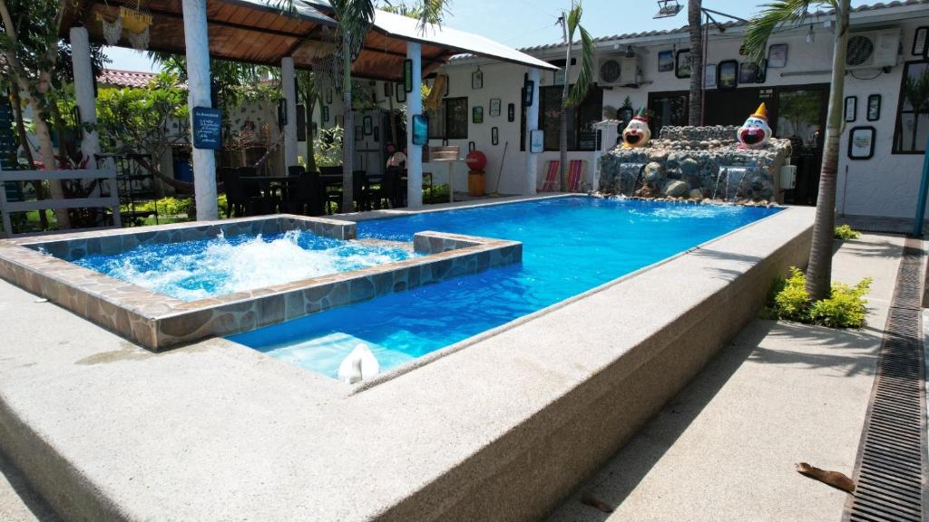 a pool at a resort with a swimming pool at Casa Halley #2 con vista al mar , Playas in Data de Posorja