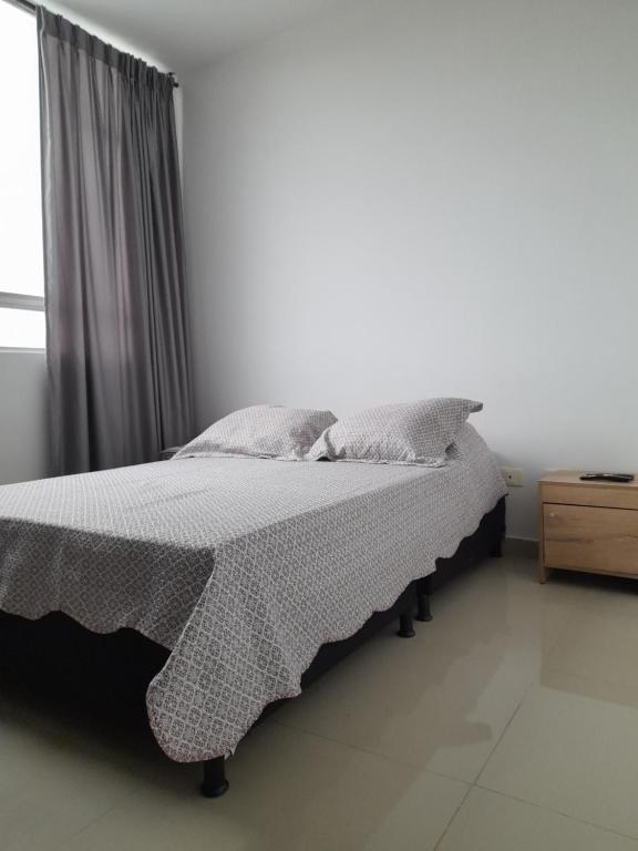 Postel nebo postele na pokoji v ubytování Casa Colibrí Hospedaje Manizales a 2 min del Cable y 1 min Zona G