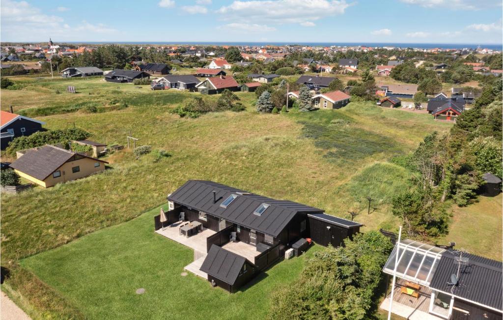 an overhead view of a house on a grassy hill at Amazing Home In Thisted With 3 Bedrooms And Wifi in Nørre Vorupør