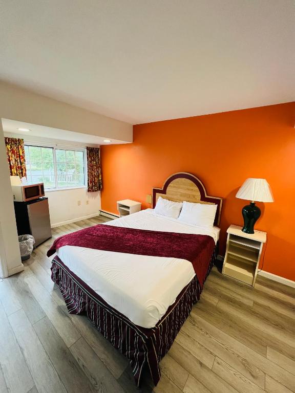 Postel nebo postele na pokoji v ubytování Colonel Williams Resort and Suites