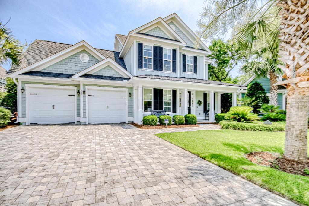 a house with a driveway in front of it at Barefoot Livin' in Myrtle Beach