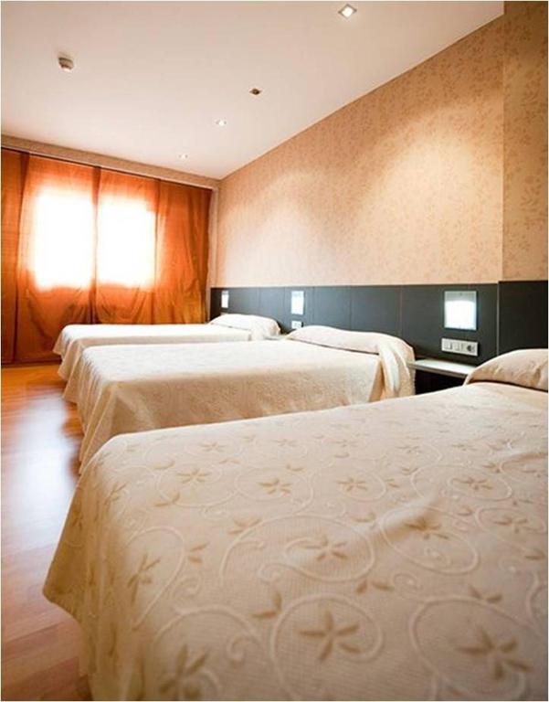 Postel nebo postele na pokoji v ubytování Hotel Area Serrano