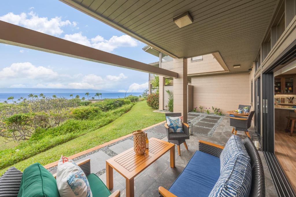 an outdoor patio with a view of the ocean at Kapalua Ridge Villas 2612 in Kahana