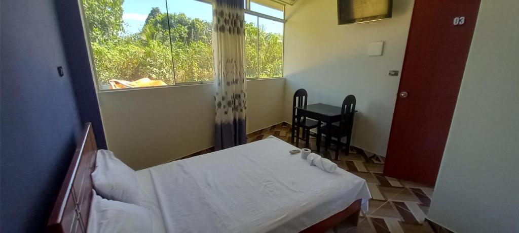Postel nebo postele na pokoji v ubytování Hospedaje Miraflores