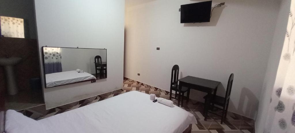 Postel nebo postele na pokoji v ubytování Hospedaje Miraflores