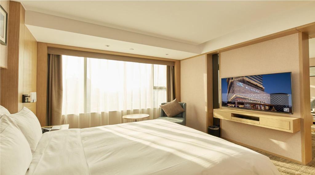 TV a/nebo společenská místnost v ubytování Zenith Hotel-Near Train Station & The Mixc