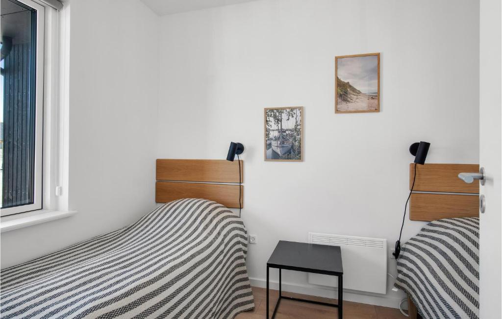 Postel nebo postele na pokoji v ubytování Havnehusene, Lejl, 37