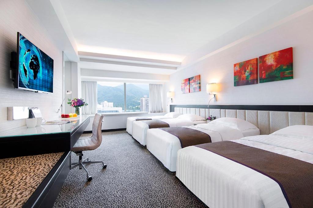 Voodi või voodid majutusasutuse Regal Riverside Hotel toas