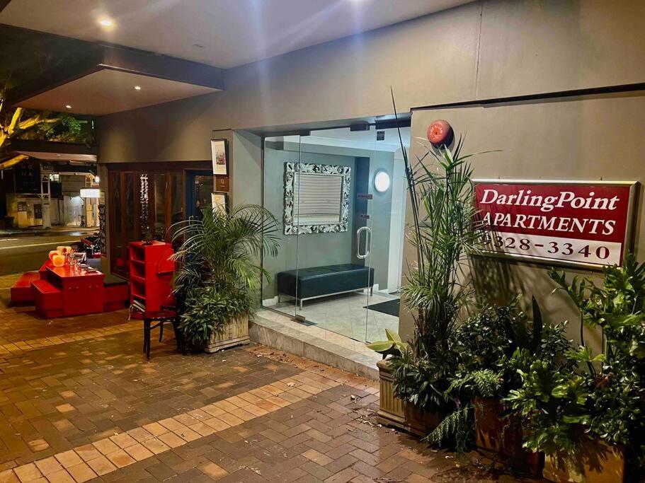 a building with a sign in front of a store at Studio in Darling Point in Sydney