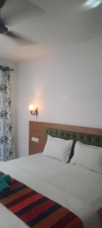 Postel nebo postele na pokoji v ubytování Eve Resort