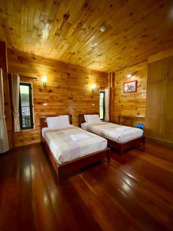 Voodi või voodid majutusasutuse Baan Soontree Resort toas