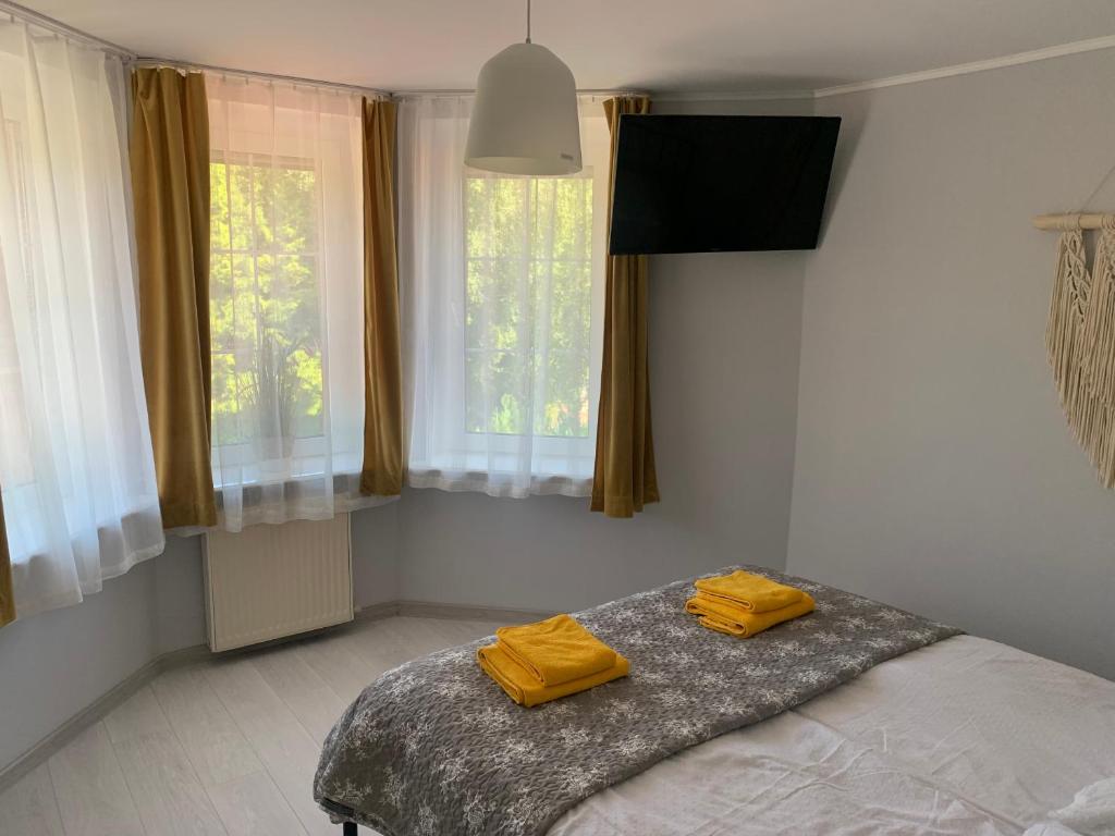 Postel nebo postele na pokoji v ubytování AMBER Dębki