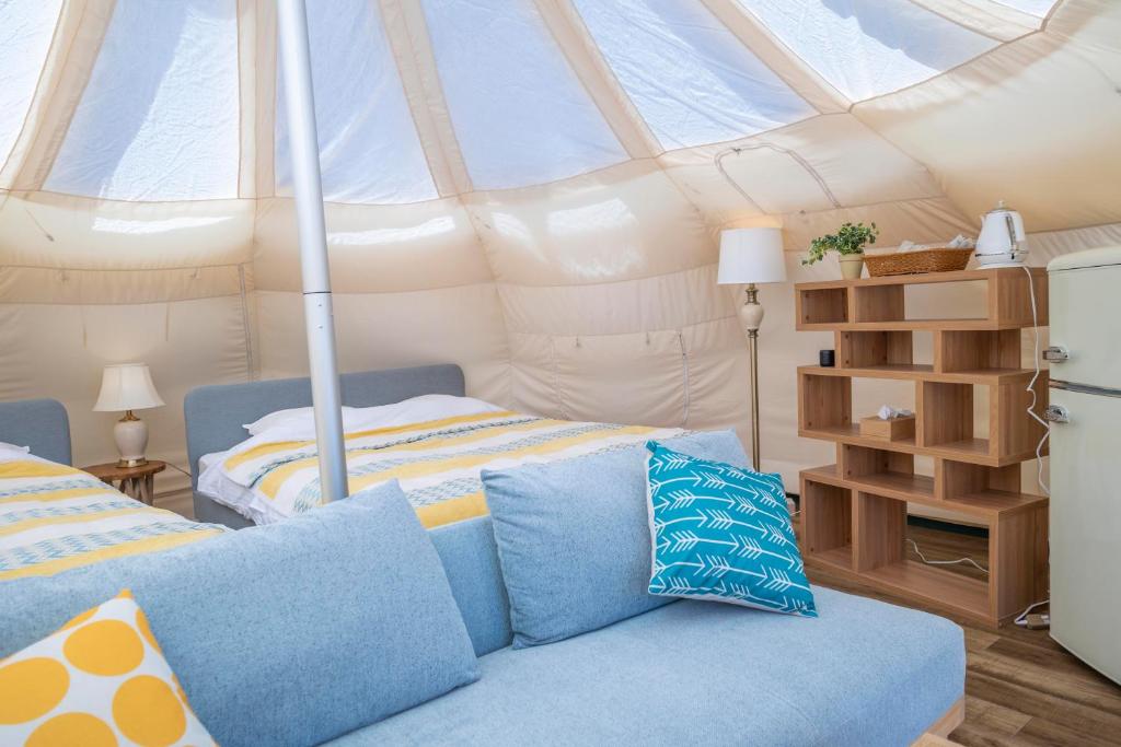 Postel nebo postele na pokoji v ubytování Glamping&Port結