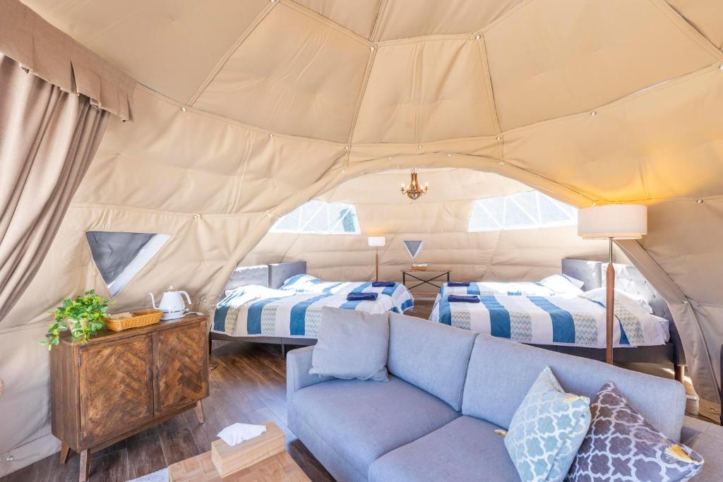 Postel nebo postele na pokoji v ubytování Glamping&Port結