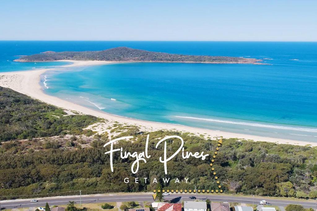 an aerial view of a beach and the ocean at Fingal Pines Getaway, Apartment in Fingal Bay