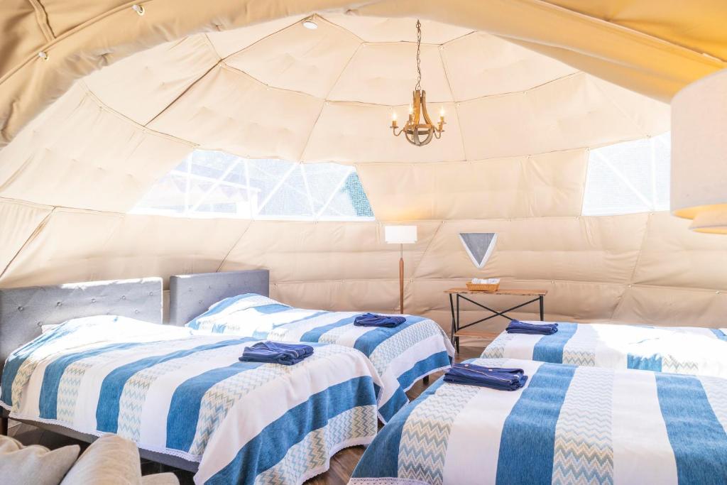 Postel nebo postele na pokoji v ubytování Glamping&Port結