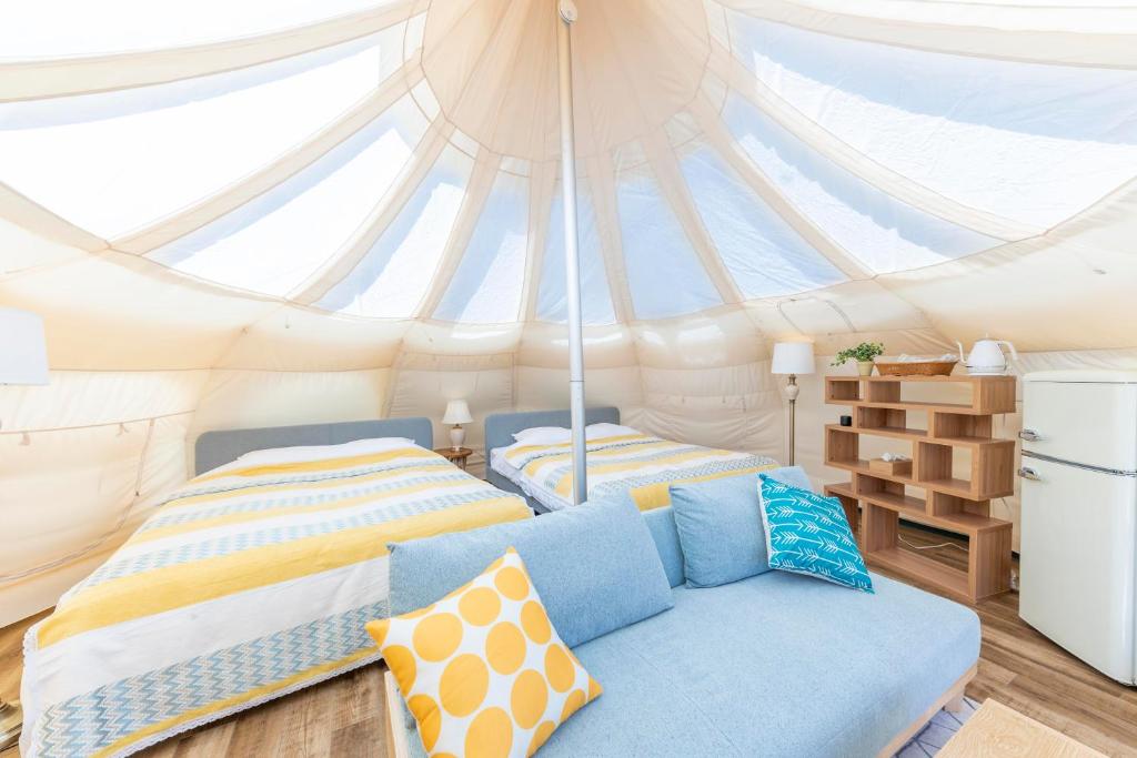 Postel nebo postele na pokoji v ubytování Glamping&Port結