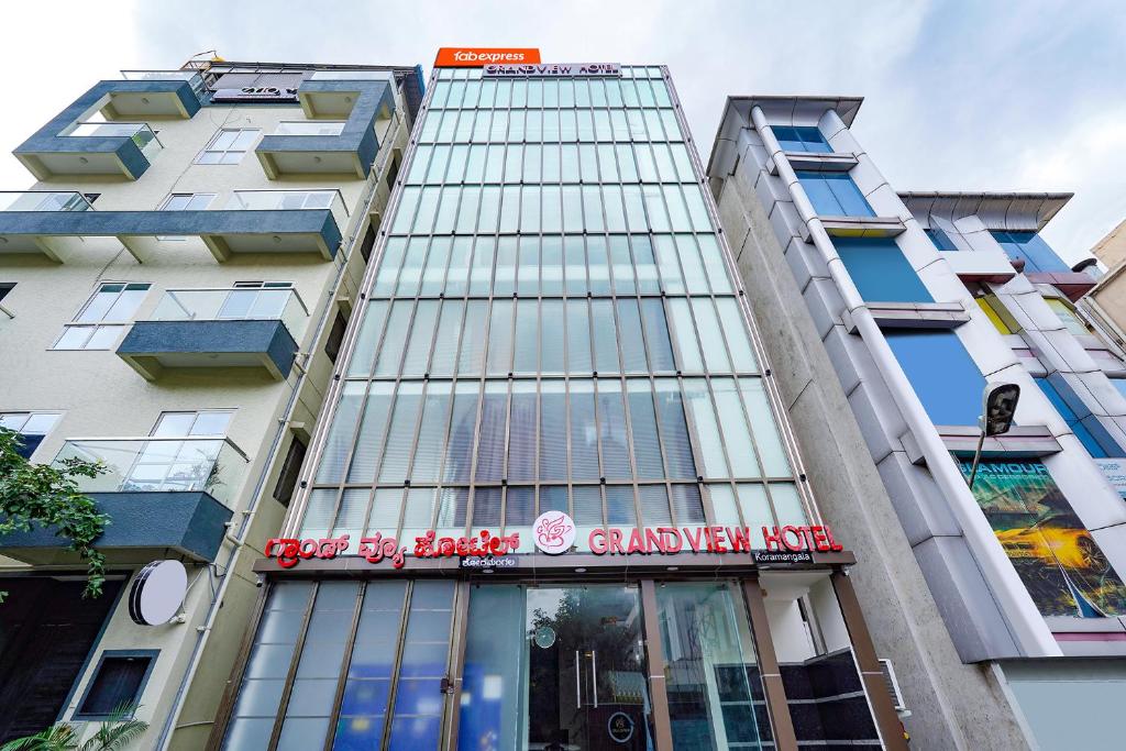 a building with a sign on the side of it at FabExpress Grand View in Bangalore