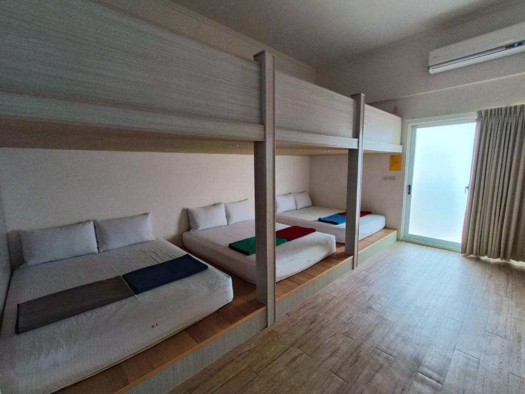Postel nebo postele na pokoji v ubytování Moumoon B&B