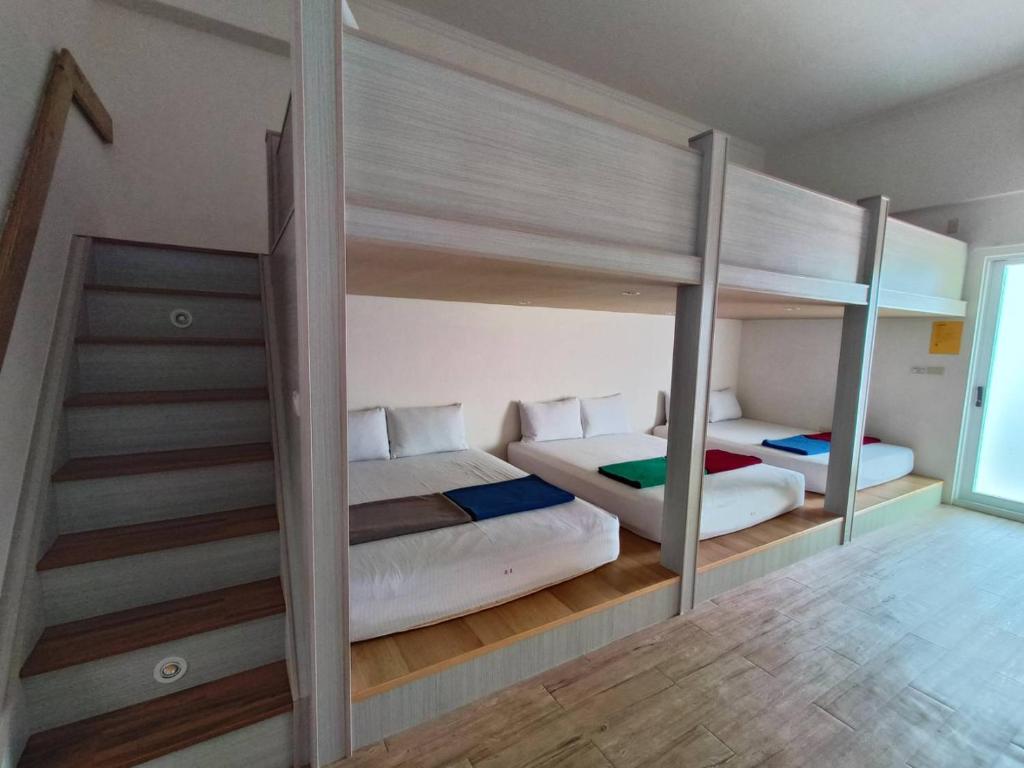 Postel nebo postele na pokoji v ubytování Moumoon B&B