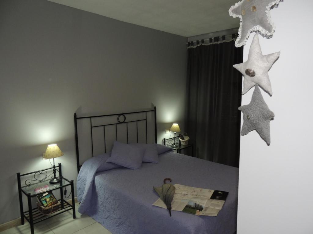 Postel nebo postele na pokoji v ubytování Hostal Can Massot