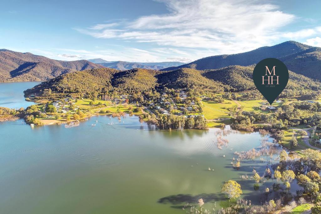 a hot air balloon flying over a lake at The Sticks in Goughs Bay