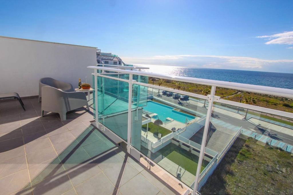 a balcony with a view of the ocean at Ático frontal al mar en Duna Beach con vistas in Torrox Costa