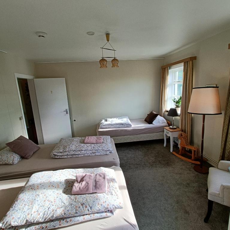 Postel nebo postele na pokoji v ubytování Arsalir Guesthouse Vik B&B