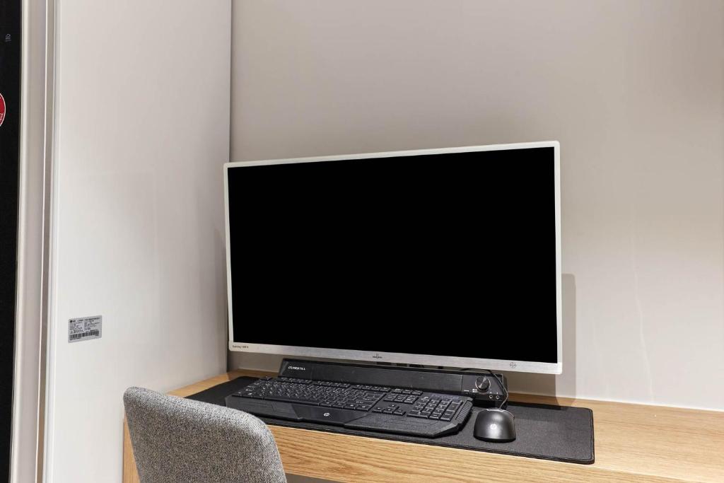 TV a/nebo společenská místnost v ubytování Wonju Central Hotel
