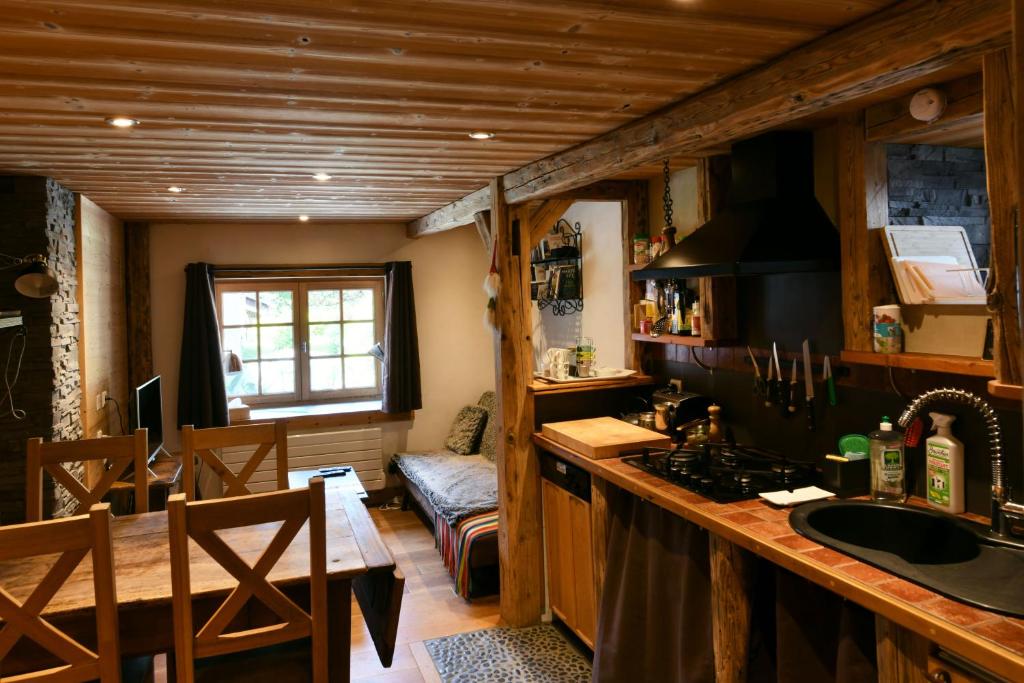 a kitchen with a sink and a counter top at Les Posettes, appartement Le Sizeray - Mont Blanc in Vallorcine