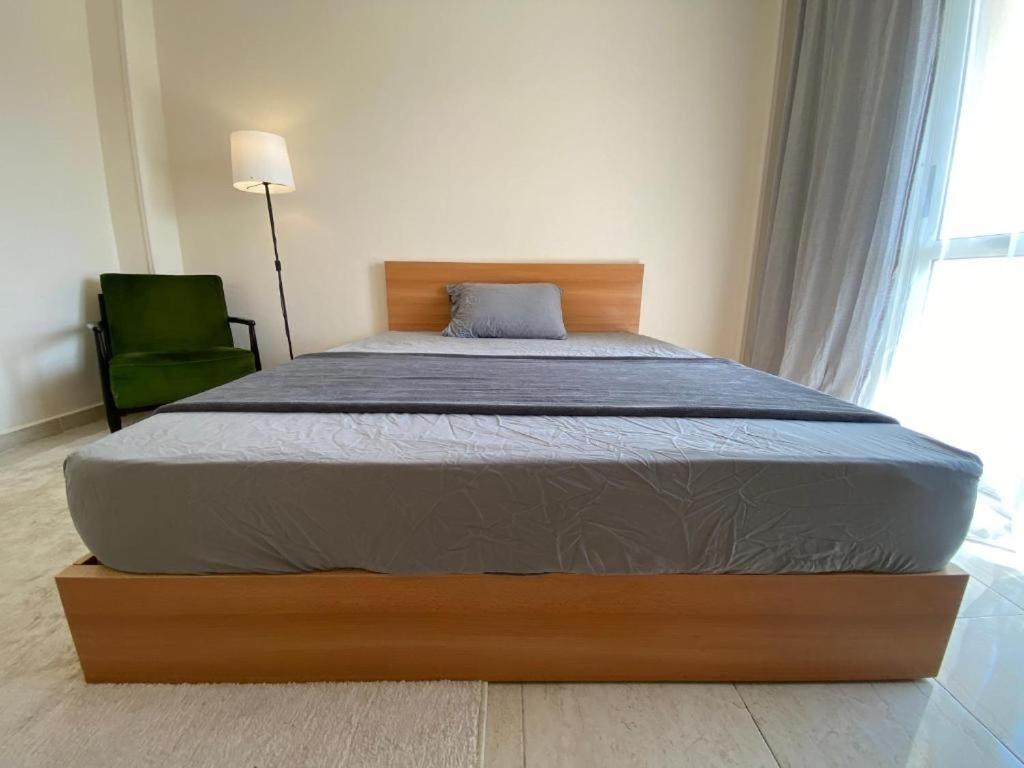 Postel nebo postele na pokoji v ubytování Madinaty Hotel