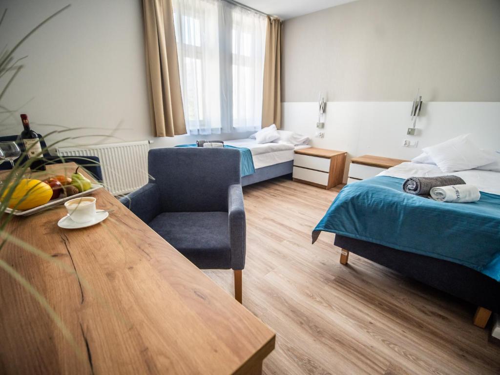 Postel nebo postele na pokoji v ubytování Sanatorium Mewa
