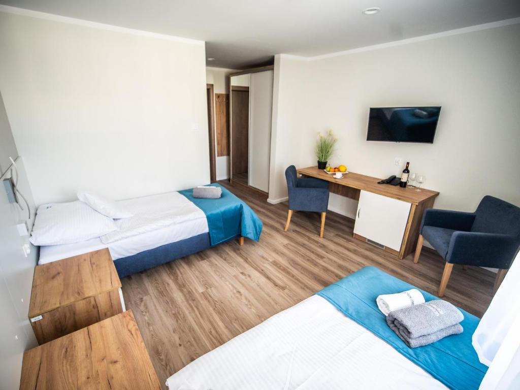Postel nebo postele na pokoji v ubytování Sanatorium Mewa