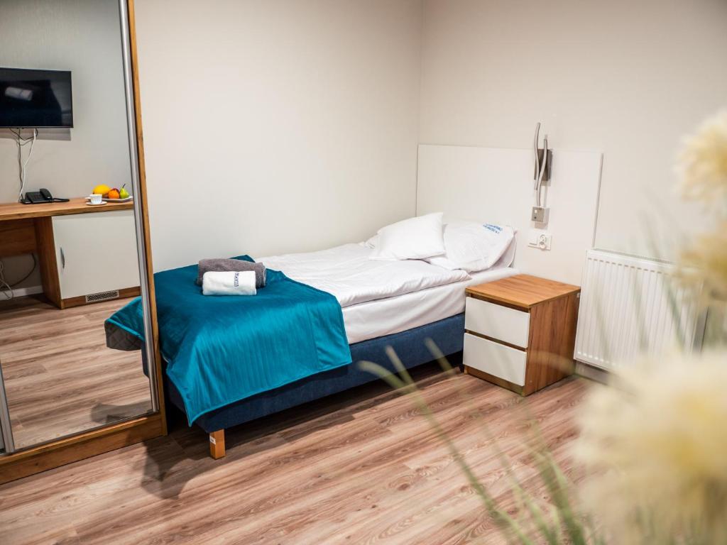 Postel nebo postele na pokoji v ubytování Sanatorium Mewa