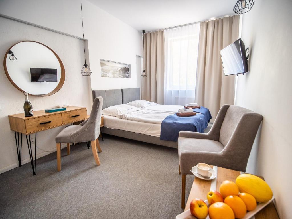 Posteľ alebo postele v izbe v ubytovaní Sanatorium Muszelka