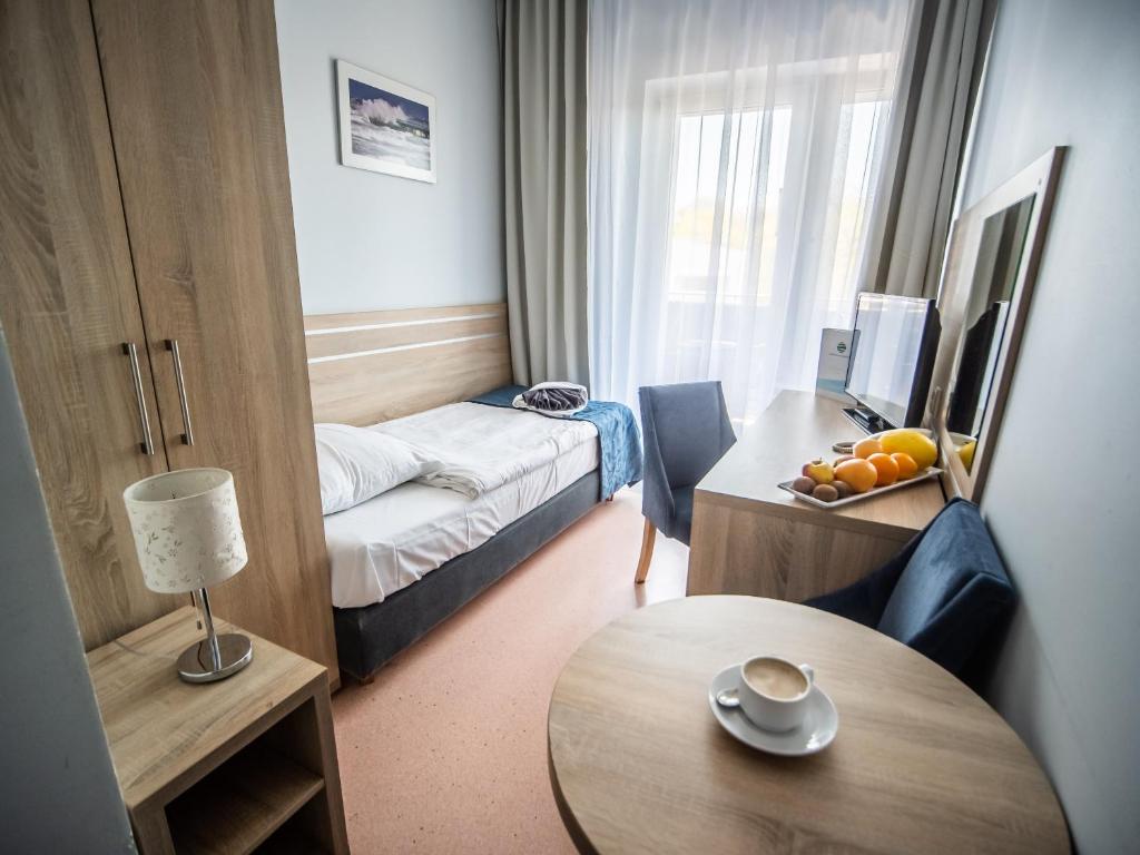 Posteľ alebo postele v izbe v ubytovaní Sanatorium Muszelka