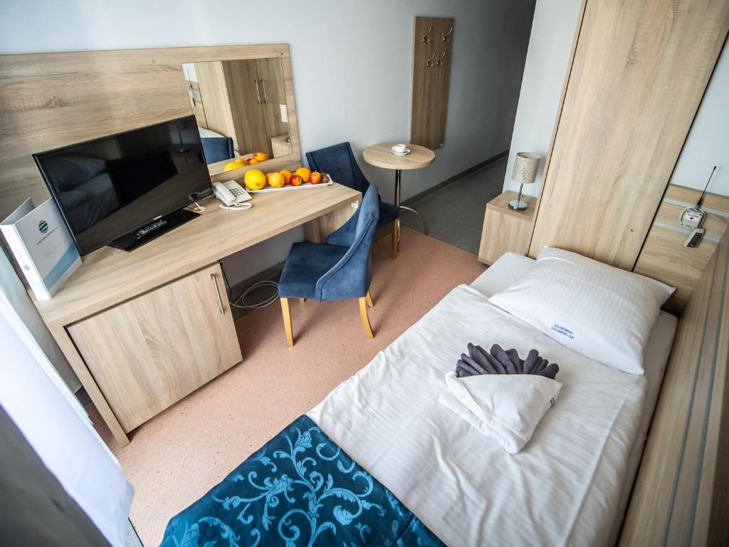 Posteľ alebo postele v izbe v ubytovaní Sanatorium Muszelka