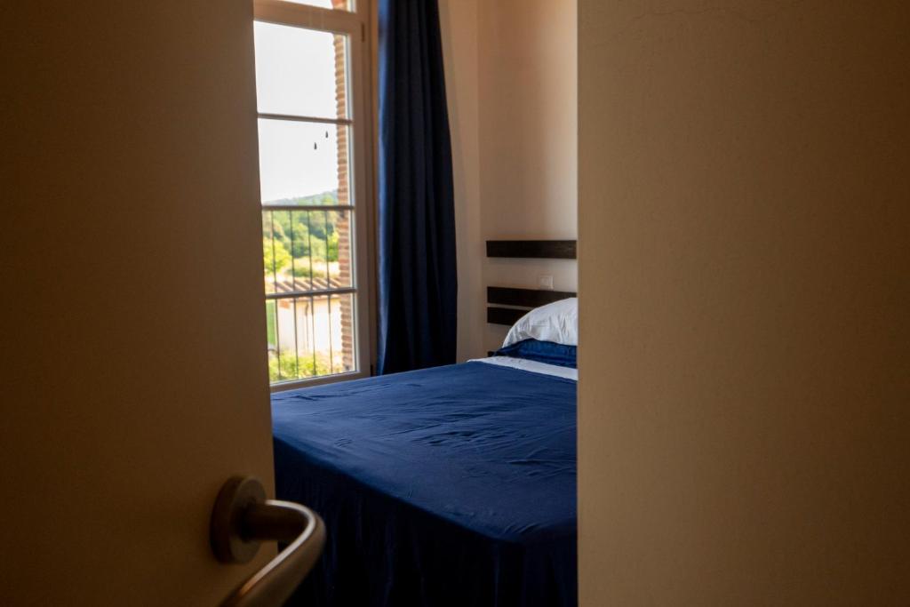 Postel nebo postele na pokoji v ubytování Corte Volpe Home