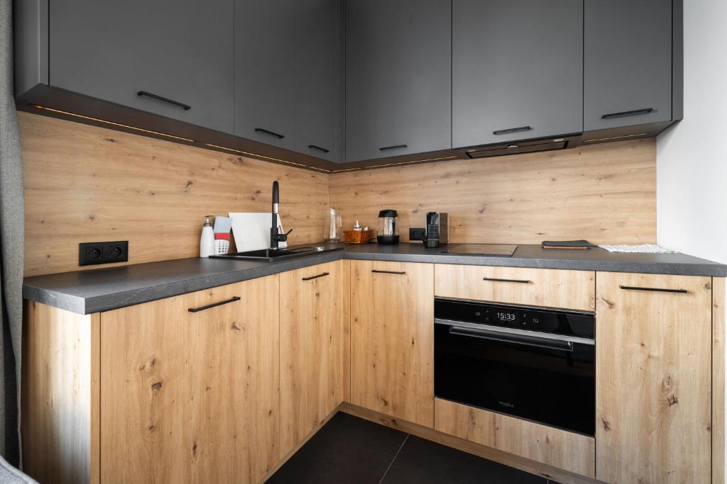 Kuchyň nebo kuchyňský kout v ubytování Apartmány Florián