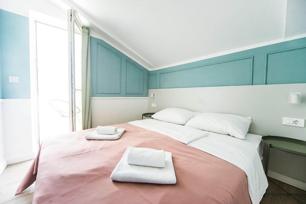 Posteľ alebo postele v izbe v ubytovaní Hotel Plaza