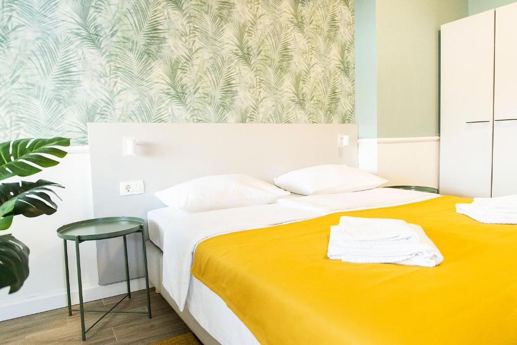 Posteľ alebo postele v izbe v ubytovaní Hotel Plaza