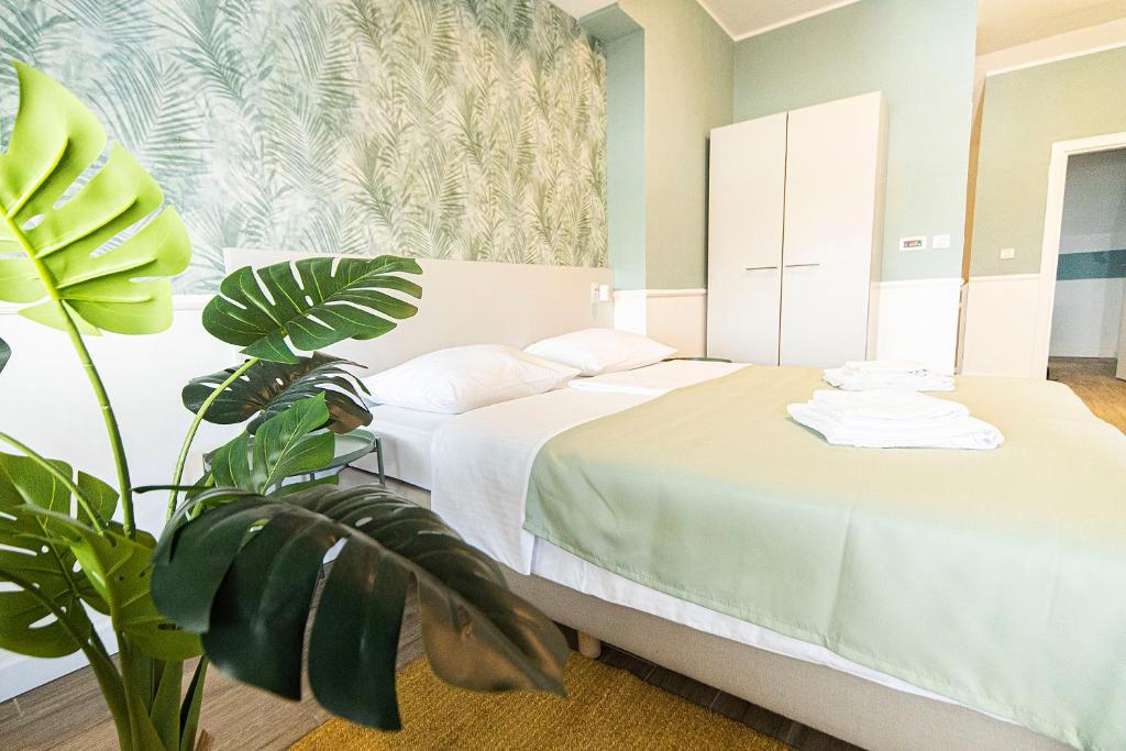 Posteľ alebo postele v izbe v ubytovaní Hotel Plaza