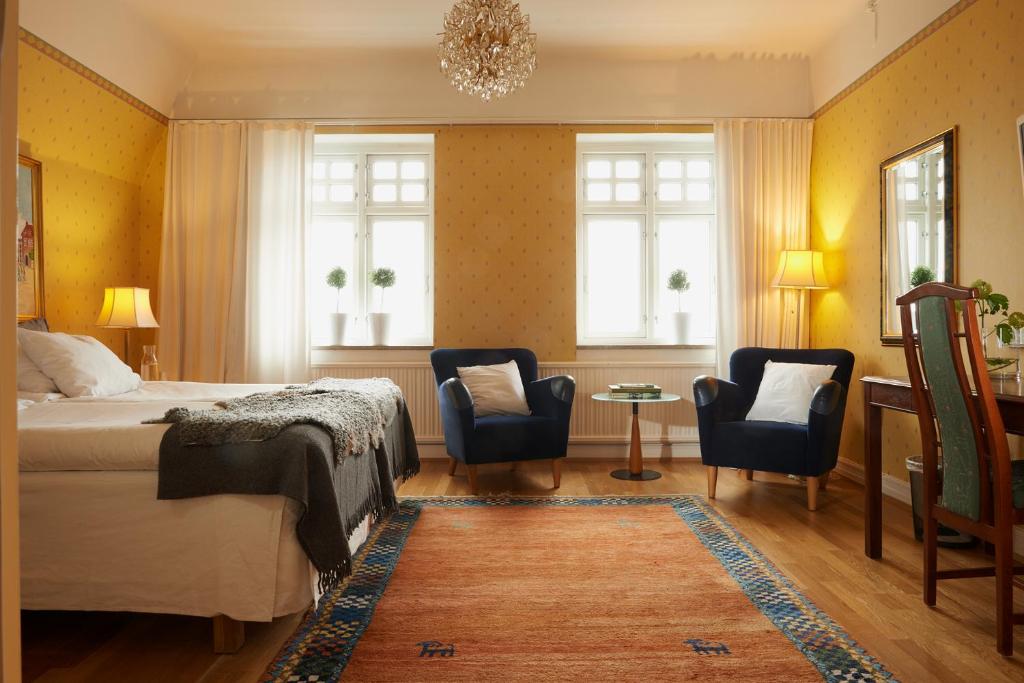 Postel nebo postele na pokoji v ubytování Kiviks Hotell